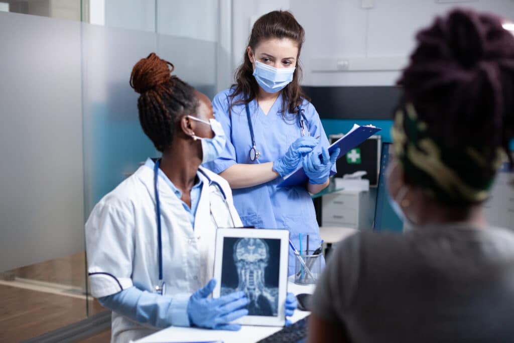 Family medicine physician mentoring a medical student in an outpatient clinic